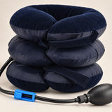Close-up of the navy three-chamber inflatable neck collar showing its two adjustable fabric fastening straps and soft stitched surface.
